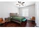 Warm bedroom features a wooden bed frame, two side tables, and modern furnishings at 3662 Riley Ann Ave, Las Vegas, NV 89139