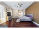 Bright bedroom with hardwood floors, ceiling fan, and large windows for natural light at 3662 Riley Ann Ave, Las Vegas, NV 89139
