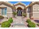 Inviting front entrance with double doors, stone pathway, and manicured landscaping at 3662 Riley Ann Ave, Las Vegas, NV 89139