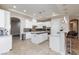 Bright, spacious kitchen featuring white cabinets, stainless appliances, and a stylish island at 3662 Riley Ann Ave, Las Vegas, NV 89139