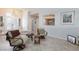 Bright living room with tile floors, recessed lighting, and comfortable seating area at 3662 Riley Ann Ave, Las Vegas, NV 89139