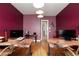 Spacious home office with two large desks, hardwood floors, and modern lighting at 3662 Riley Ann Ave, Las Vegas, NV 89139