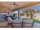 Spacious covered patio with seating area and a view of the landscaped backyard at 3662 Riley Ann Ave, Las Vegas, NV 89139