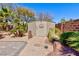 View of the backyard shed surrounded by desert landscaping with brick lined walkway at 3662 Riley Ann Ave, Las Vegas, NV 89139