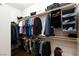 Well-organized walk-in closet with double hanging rods and storage solutions for maximum organization at 3662 Riley Ann Ave, Las Vegas, NV 89139