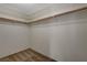 Spacious walk-in closet with ample shelving and rod space for organized storage, features plush carpeting at 3667 Edinburgh Dr, Las Vegas, NV 89103