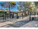 Gated community entrance with mature trees and landscaping adding to the curb appeal at 3667 Edinburgh Dr, Las Vegas, NV 89103