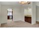 Cozy dining area with built-in bar, plush carpet and modern chandelier at 3667 Edinburgh Dr, Las Vegas, NV 89103