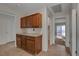 Transitional hallway features ample cabinet and counter space with easy access to other rooms, enhancing convenience at 3667 Edinburgh Dr, Las Vegas, NV 89103