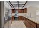 Kitchen with stainless steel appliances, tile floors, and granite countertops at 3667 Edinburgh Dr, Las Vegas, NV 89103