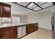 Kitchen featuring stainless steel dishwasher and tile floors at 3667 Edinburgh Dr, Las Vegas, NV 89103