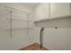 Functional laundry room offers wire shelving and cabinet storage, providing ample space for supplies and convenience at 3667 Edinburgh Dr, Las Vegas, NV 89103