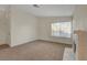 Spacious living room with fireplace, neutral carpet, and natural light at 3667 Edinburgh Dr, Las Vegas, NV 89103