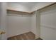 Spacious walk-in closet featuring rods for ample storage and a carpeted floor, ensuring organized convenience at 3667 Edinburgh Dr, Las Vegas, NV 89103