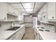 Efficient kitchen design showcasing modern appliances, durable countertops, and ample storage space at 3683 Villa Knolls East Dr, Las Vegas, NV 89120
