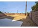 Expansive backyard with large patio area and mature trees, ready for landscaping at 3914 Steinbeck Dr, Las Vegas, NV 89115