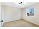 Cozy bedroom featuring closet, window, and updated light fixture at 3914 Steinbeck Dr, Las Vegas, NV 89115