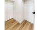 Walk-in closet with wood-look flooring and ample shelving space at 3914 Steinbeck Dr, Las Vegas, NV 89115
