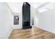 Bright living room with a modern black fireplace and light wood flooring at 3914 Steinbeck Dr, Las Vegas, NV 89115