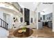 Inviting living area with a fireplace, high ceilings, modern decor, and an open layout to the kitchen and dining spaces at 3914 Steinbeck Dr, Las Vegas, NV 89115