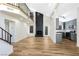 Bright, open living area with a fireplace, high ceilings, modern decor, and a seamless flow into the kitchen and dining spaces at 3914 Steinbeck Dr, Las Vegas, NV 89115