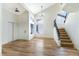 Bright living area with natural light, and stairway with carpet runner at 3914 Steinbeck Dr, Las Vegas, NV 89115