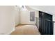 Loft space with carpet and window adjacent to the fireplace at 3914 Steinbeck Dr, Las Vegas, NV 89115