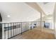 Carpeted loft space with railing overlooking main level below at 3914 Steinbeck Dr, Las Vegas, NV 89115