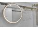 Beautiful bathroom with modern, lighted mirror, large tiles and a gold toned towel rack at 3930 University Center Dr # 909, Las Vegas, NV 89119