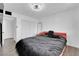 Simple bedroom features a comfortable bed, closet and ceiling fan at 3930 University Center Dr # 909, Las Vegas, NV 89119