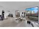 Bright gym offering a bench press, punching bag, and free weights with exterior views and lighting at 3930 University Center Dr # 909, Las Vegas, NV 89119