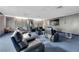 Home theater featuring comfortable, reclining chairs, a large screen, and dimmed lighting at 3930 University Center Dr # 909, Las Vegas, NV 89119