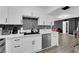 Modern kitchen with white cabinetry, stainless steel appliances, and stylish countertop at 3930 University Center Dr # 909, Las Vegas, NV 89119