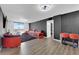 Bright living room showcasing a stylish sectional, city view, and modern accent wall at 3930 University Center Dr # 909, Las Vegas, NV 89119