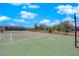 Well-maintained tennis court surrounded by lush greenery, offering a great recreational amenity at 3930 University Center Dr # 909, Las Vegas, NV 89119