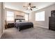 Cozy bedroom features a ceiling fan and natural lighting coming through the window at 4227 Diya Ave, North Las Vegas, NV 89084