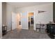 Neutral bedroom with gray carpet and wall color, showcasing an Ohio State banner and easy access to the bathroom at 4227 Diya Ave, North Las Vegas, NV 89084