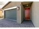 Exterior view of a one-story house showing garage, brick driveway and front door at 4227 Diya Ave, North Las Vegas, NV 89084