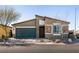 Charming single-story home featuring a well-maintained front yard and stone accents at 4227 Diya Ave, North Las Vegas, NV 89084