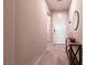 Bright hallway featuring neutral paint, tile flooring, and stylish entryway decor at 4227 Diya Ave, North Las Vegas, NV 89084
