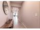 Bright hallway with tile flooring that leads to an open-concept living and dining area at 4227 Diya Ave, North Las Vegas, NV 89084