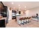 Spacious kitchen boasts a granite island with seating, dark cabinetry, and modern appliances at 4227 Diya Ave, North Las Vegas, NV 89084
