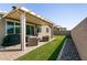Paver patio with outdoor seating, a grill, and a covered area perfect for relaxing and entertaining at 4227 Diya Ave, North Las Vegas, NV 89084