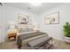 Staged bedroom featuring modern decor, neutral tones, and contemporary artwork at 4471 Dean Martin Dr # 1207, Las Vegas, NV 89103