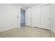 Bedroom provides ample closet space, light wood floors, and a view to the ensuite bathroom at 4471 Dean Martin Dr # 1207, Las Vegas, NV 89103