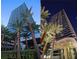 Modern high-rise showcasing architectural design, palm trees, and both daytime and nighttime views at 4471 Dean Martin Dr # 1207, Las Vegas, NV 89103