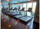 Well-equipped fitness center features modern treadmills with large windows and polished hardwood floors at 4471 Dean Martin Dr # 1207, Las Vegas, NV 89103
