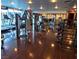 Bright gym with treadmills, weight machines, and dark, shiny wood-look floors at 4471 Dean Martin Dr # 1207, Las Vegas, NV 89103