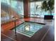 Indoor hot tub surrounded by floor-to-ceiling windows and stylish seating at 4471 Dean Martin Dr # 1207, Las Vegas, NV 89103