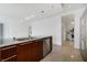 Modern kitchen featuring a sink, stainless steel dishwasher, and wooden cabinets at 4471 Dean Martin Dr # 1207, Las Vegas, NV 89103